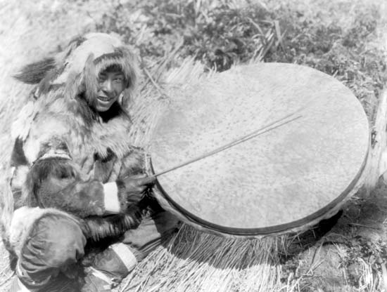 Eskimo man with drum